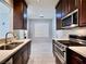 Kitchen with stainless steel appliances, modern cabinets, and marble flooring at 248 Crystal Rose Ct, Las Vegas, NV 89106