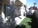 A view of a backyard with grass and a patio at 254 Horizon Pointe Cir, Henderson, NV 89012