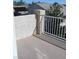 An empty balcony with a stucco wall overlooking the neighborhood at 254 Horizon Pointe Cir, Henderson, NV 89012