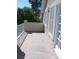An empty balcony with a white railing and stucco wall overlooking the neighborhood at 254 Horizon Pointe Cir, Henderson, NV 89012