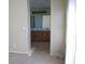 Open bathroom area with dual sinks, dark cabinets, and a large mirror at 254 Horizon Pointe Cir, Henderson, NV 89012