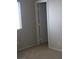 A bedroom with neutral walls, carpet flooring, and a single window at 254 Horizon Pointe Cir, Henderson, NV 89012