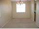 Bright dining room with a chandelier and ample natural light from a large window at 254 Horizon Pointe Cir, Henderson, NV 89012