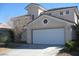 Charming two-story home featuring a two-car garage and a well-maintained front yard at 254 Horizon Pointe Cir, Henderson, NV 89012