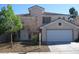 Charming two-story home featuring a two-car garage and a well-maintained front yard at 254 Horizon Pointe Cir, Henderson, NV 89012