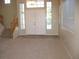Welcoming foyer with tile flooring, staircase, and natural light from large windows at 254 Horizon Pointe Cir, Henderson, NV 89012