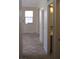 Hallway with tile flooring and neutral paint, offering easy access to different areas at 254 Horizon Pointe Cir, Henderson, NV 89012