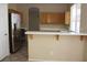 Well-lit kitchen with breakfast bar, stainless steel appliances, and plenty of counter space at 254 Horizon Pointe Cir, Henderson, NV 89012