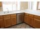 Functional kitchen with stainless steel dishwasher, sink, and ample cabinet space at 254 Horizon Pointe Cir, Henderson, NV 89012