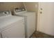 A laundry room with a side-by-side washer and dryer at 254 Horizon Pointe Cir, Henderson, NV 89012