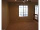 Upstairs living area with a window, railing, and neutral carpeting at 254 Horizon Pointe Cir, Henderson, NV 89012