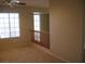 Upstairs living area with a window, railing, and neutral carpeting at 254 Horizon Pointe Cir, Henderson, NV 89012