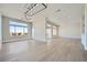 Spacious living area with large windows offering scenic views and light wood flooring at 2904 Bow Bridge Dr, Las Vegas, NV 89134