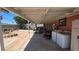 This covered patio combines outdoor living with practical amenities like laundry hookups for convenience at 2965 Palma Vista Cir, Las Vegas, NV 89169
