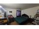 A view of a bedroom with dark furnishings and carpet at 2965 Palma Vista Cir, Las Vegas, NV 89169