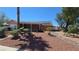 A single-story home with desert landscaping, solar panels, and a covered patio at 2965 Palma Vista Cir, Las Vegas, NV 89169