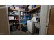 Functional laundry room with storage shelves, washing machine, and utility sink offers practicality and organization at 2965 Palma Vista Cir, Las Vegas, NV 89169