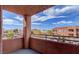 View from a covered balcony of the surrounding buildings, trees, and parked cars at 3318 N Decatur Blvd # 2103, Las Vegas, NV 89130
