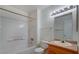 Bright bathroom with a white tiled shower-tub combo and a vanity with ample counter space at 3318 N Decatur Blvd # 2103, Las Vegas, NV 89130