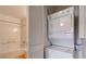 Bathroom with shower-tub combo, laundry closet and stacked washer and dryer at 3318 N Decatur Blvd # 2103, Las Vegas, NV 89130