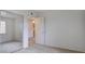 Spacious carpeted bedroom with a mirrored closet and an open doorway leading to other rooms at 3318 N Decatur Blvd # 2103, Las Vegas, NV 89130