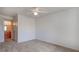 This bedroom with neutral carpet provides an ensuite bathroom and ceiling fan at 3318 N Decatur Blvd # 2103, Las Vegas, NV 89130