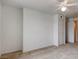 Bedroom with neutral carpet, ceiling fan, and double door closet, flooded with natural light at 3318 N Decatur Blvd # 2103, Las Vegas, NV 89130