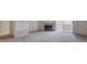 The carpeted living room offers a fireplace and sliding glass doors to the outside at 3318 N Decatur Blvd # 2103, Las Vegas, NV 89130