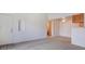 Open-concept space with neutral paint, carpet, and an arched niche for decor at 3318 N Decatur Blvd # 2103, Las Vegas, NV 89130