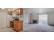This living space features a kitchen area, fireplace, and sliding glass doors to the balcony at 3318 N Decatur Blvd # 2103, Las Vegas, NV 89130