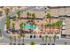 Aerial view of a residential community featuring a pool, spa, and mini-golf surrounded by lush palms at 3337 Partridge Run St, Laughlin, NV 89029