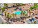 Stunning community pool and spa area surrounded by palm trees and meticulously maintained landscaping at 3337 Partridge Run St, Laughlin, NV 89029