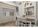 Comfortable dining room with tile flooring, a pass-through to the kitchen, and a ceiling fan at 3337 Partridge Run St, Laughlin, NV 89029