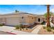 Well-maintained home exterior with a two-car garage, showcasing attractive desert landscaping at 3337 Partridge Run St, Laughlin, NV 89029