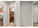 Hallway showing the view of a full bedroom and bathroom separated by wooden doors at 3337 Partridge Run St, Laughlin, NV 89029