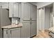 The kitchen has gray cabinets, granite countertops, and stainless steel appliances at 3337 Partridge Run St, Laughlin, NV 89029