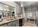 Modern kitchen featuring stainless steel appliances, granite countertops, and a view to the dining area at 3337 Partridge Run St, Laughlin, NV 89029