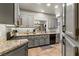The kitchen shows stainless steel appliances, granite countertops, and gray cabinets at 3337 Partridge Run St, Laughlin, NV 89029