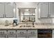 This kitchen has granite countertops and a view into the living room at 3337 Partridge Run St, Laughlin, NV 89029