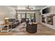 Inviting living room with a fireplace, tiled floors, and sliding glass doors to outdoor living space at 3337 Partridge Run St, Laughlin, NV 89029