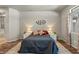 Spacious bedroom featuring stylish decor, lamps, and a large bed with a dark blue comforter at 3337 Partridge Run St, Laughlin, NV 89029