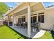 Outdoor patio features an outdoor dining set and a BBQ grill, providing ample space for entertaining at 3337 Partridge Run St, Laughlin, NV 89029