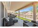 Spacious covered patio with wicker furniture and an outdoor dining set offers picturesque mountain views at 3337 Partridge Run St, Laughlin, NV 89029