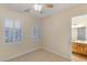 Simple bedroom with plantation shutters and doorway access to an adjacent bathroom at 3540 Wisdom Ct, Las Vegas, NV 89120