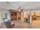 Open dining area featuring tile floors, stone fireplace, and built-in cabinets at 3540 Wisdom Ct, Las Vegas, NV 89120