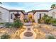 Inviting front entrance with custom pathway lighting and mature landscaping at 3540 Wisdom Ct, Las Vegas, NV 89120
