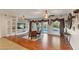 Bright living room featuring hardwood floors, custom built-ins, and natural light at 3540 Wisdom Ct, Las Vegas, NV 89120
