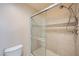 Tiled shower with sliding glass door, with toilet adjacent at 4400 S Jones Blvd # 2007, Las Vegas, NV 89103