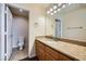 Well-lit bathroom features a granite countertop vanity and neutral tones at 4400 S Jones Blvd # 2007, Las Vegas, NV 89103