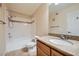 Full bathroom with granite counters, shower over tub, and warm color palette at 4400 S Jones Blvd # 2007, Las Vegas, NV 89103